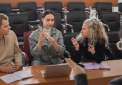 The Teacher And Students Communicate In Sign Language In The Classroom. Hearing Impaired And Deaf People